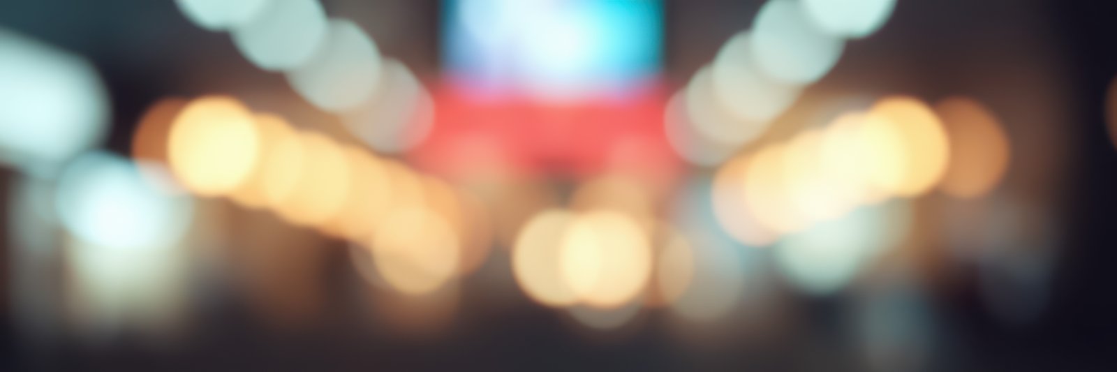 Vibrant city nightlife fills the streets with colorful lights and hustle during late evening hours